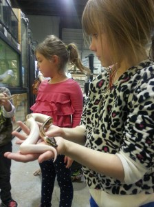 Grace holds a snake